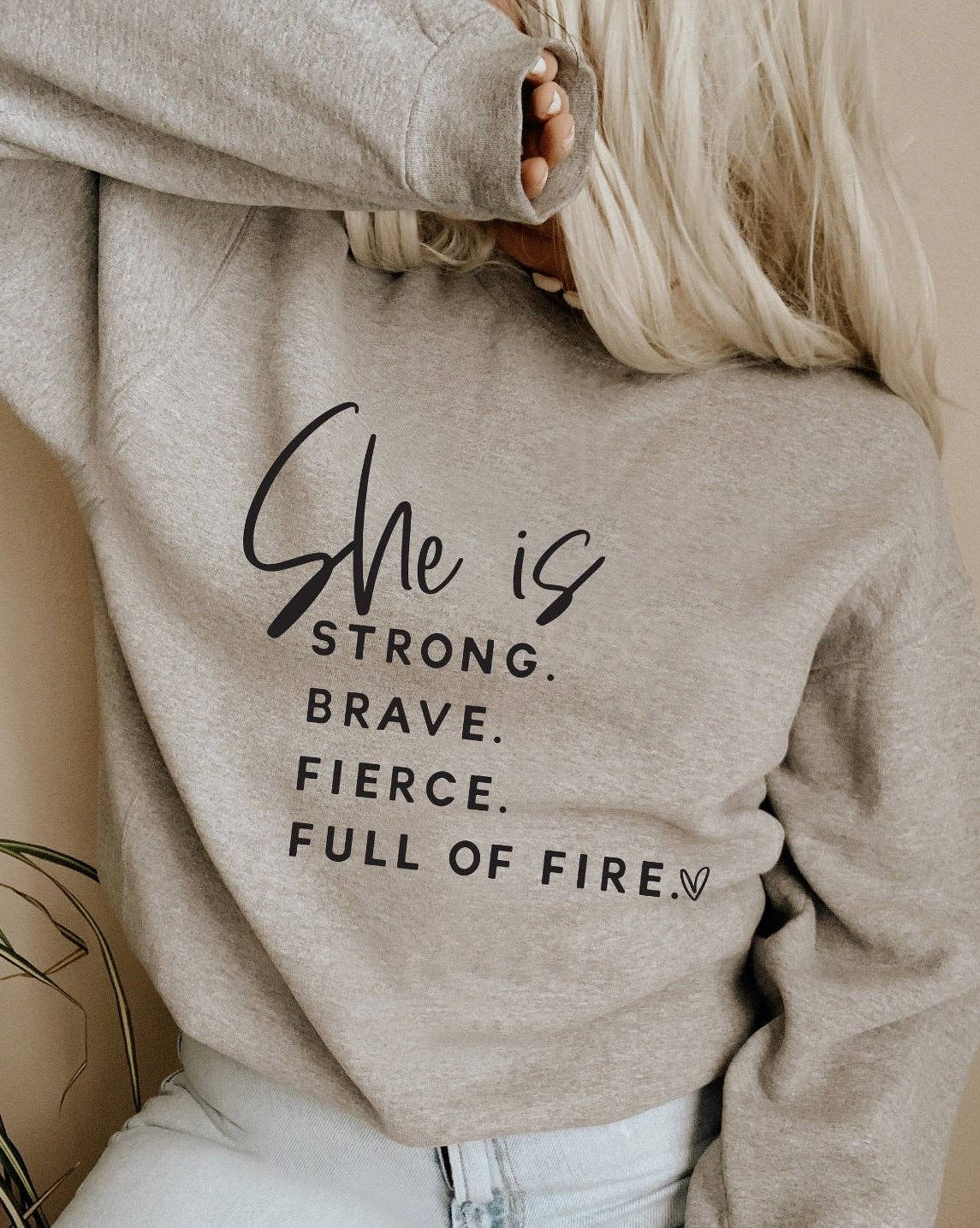 She Is Strong Brave Fierce Full Of Fire Crew Sweatshirt- light pink.